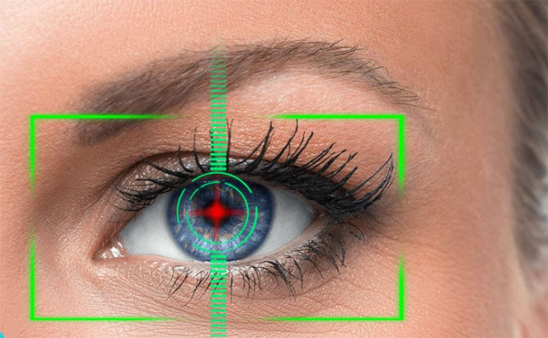 A close-up view of an eye with green targeting graphics overlaying it.